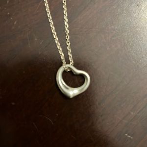 The simple, evocative shape of Elsa Peretti Open Heart designs